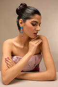 Model striking a graceful pose while wearing the Gleam Blue & Pink Drop Earrings, highlighting their exquisite craftsmanship and luxurious look.