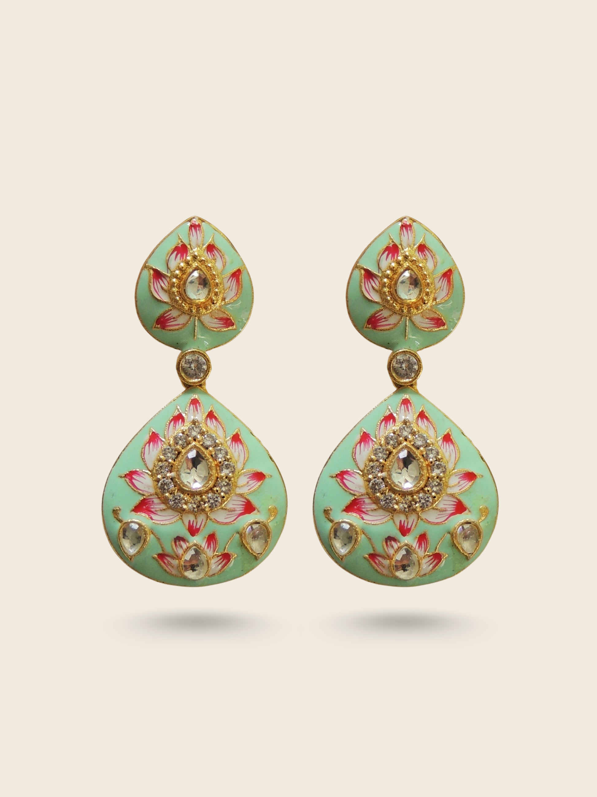 Mint green enamel drop earrings with lotus floral design, kundan stone embellishments, and traditional Indian craftsmanship.
