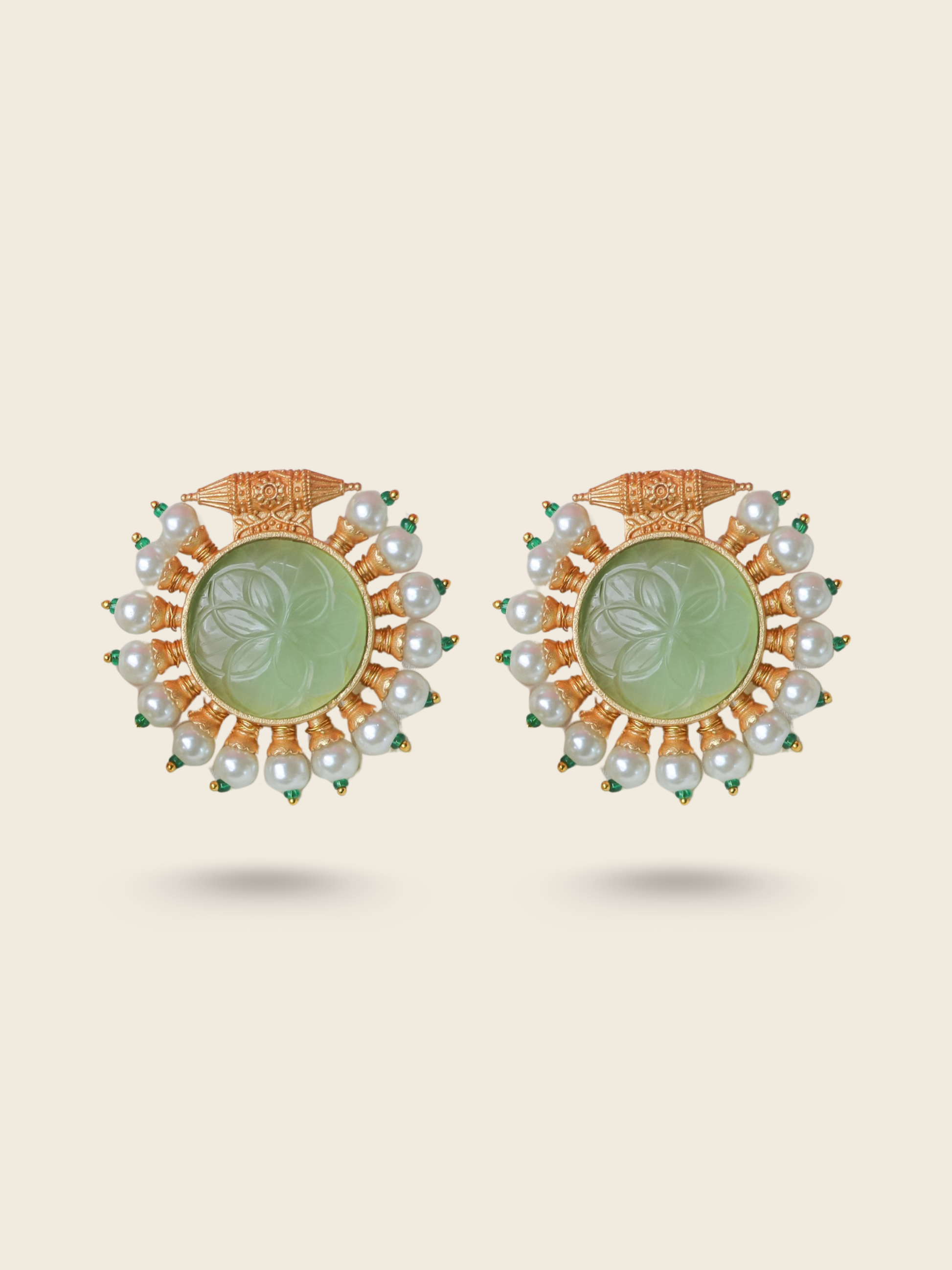 Green stone round earrings with pearl drops and peacock motif – traditional gold-toned festive jewelry for women.